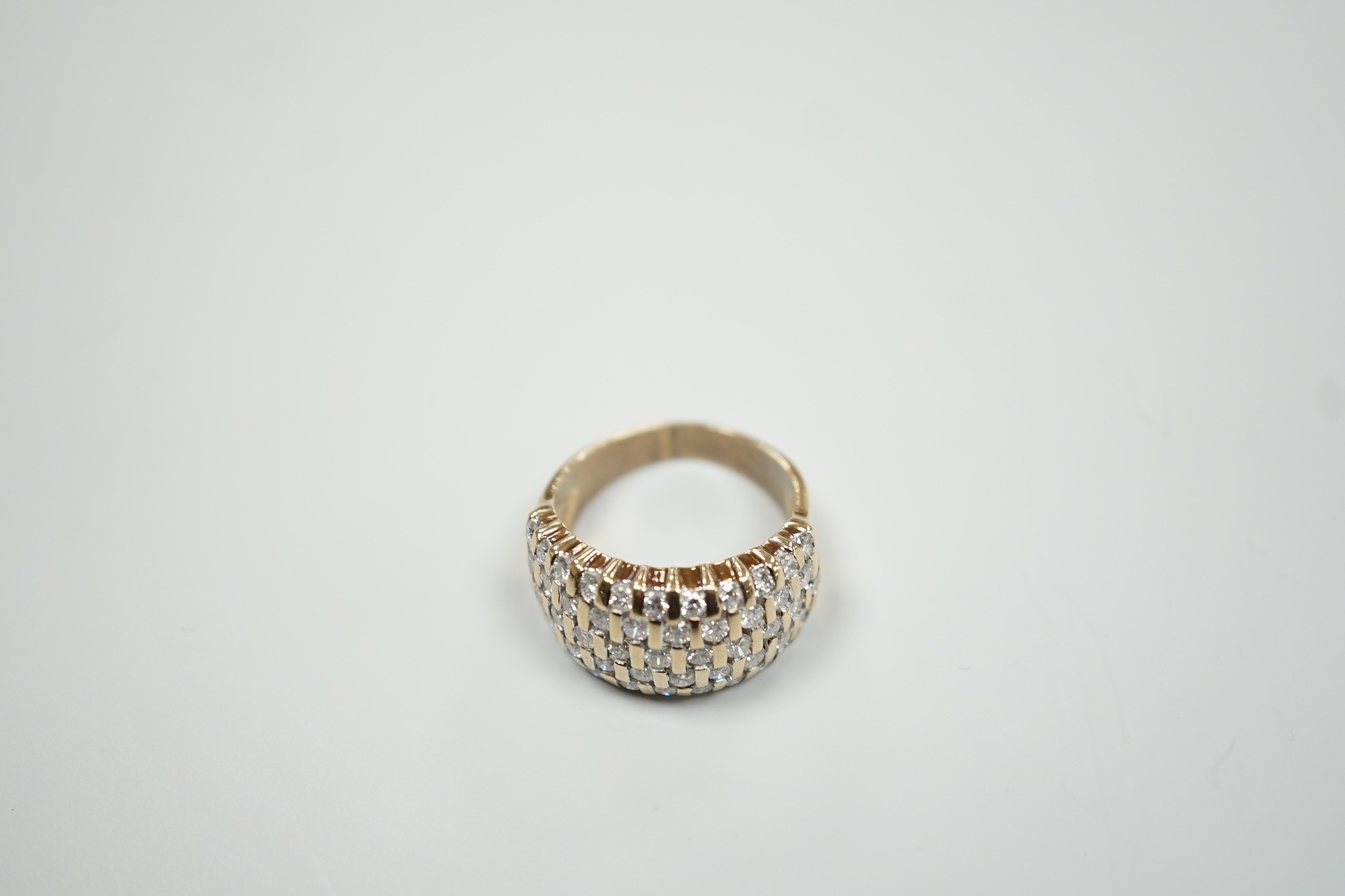 A modern yellow metal and pave set five row diamond dress ring, size R, gross weight 9.2 grams.
